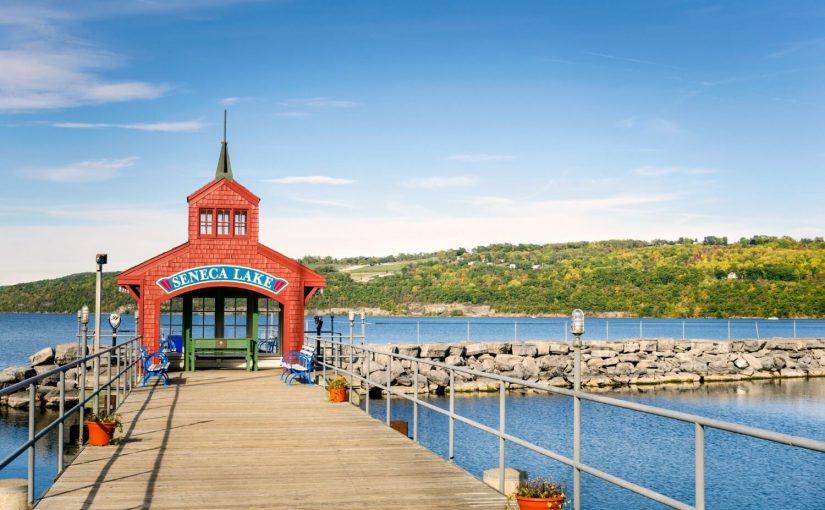 Photograph of Seneca Lake's pier in the summer. Photo credit to Finger Lakes Premier Properties.